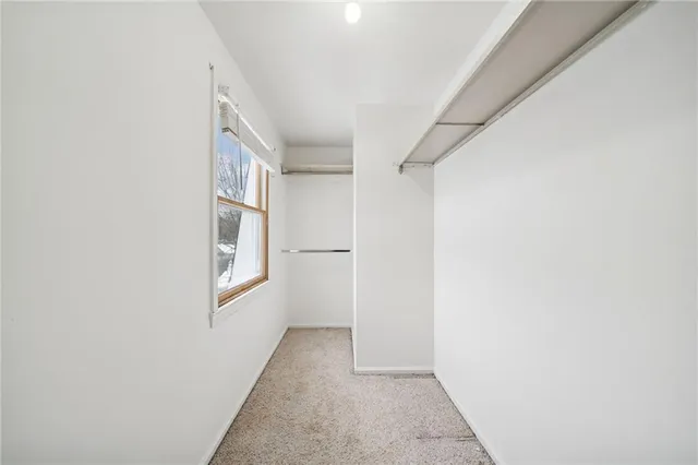 a view of hallway with windows