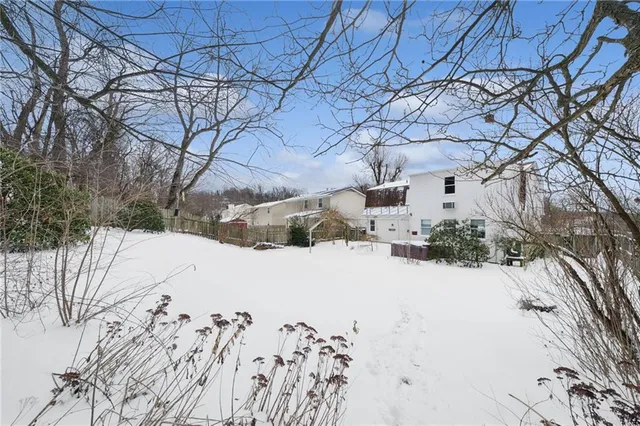 a view of side of snow with a yard