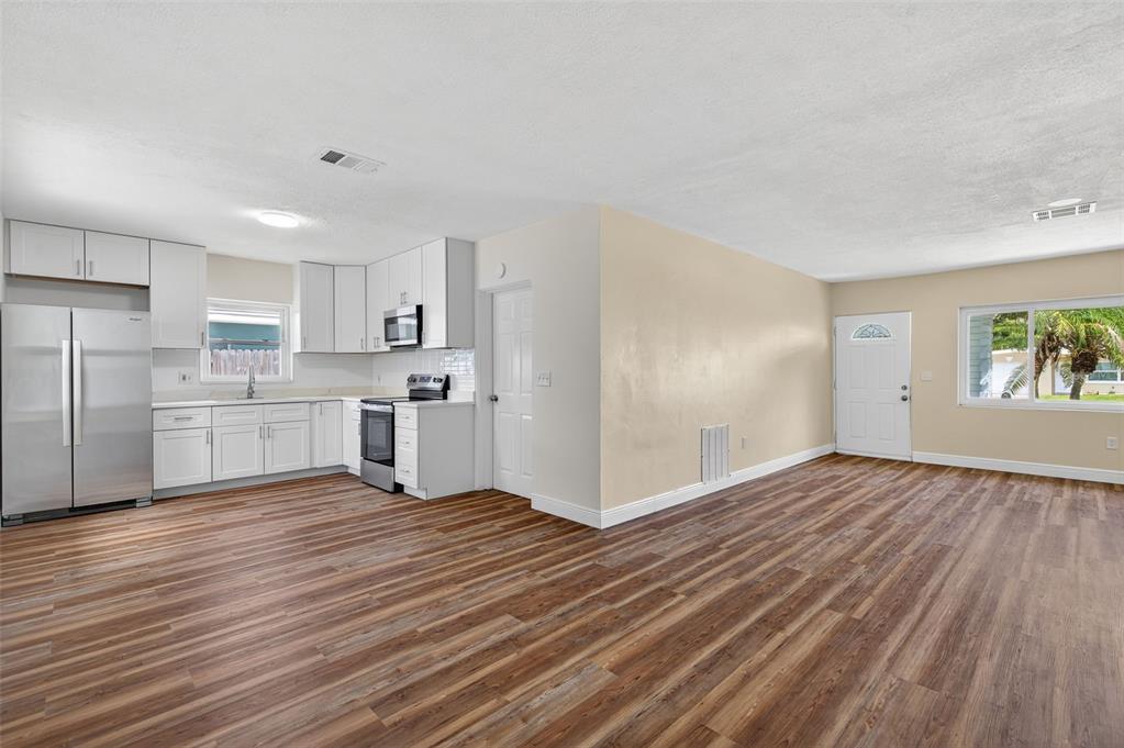12432 136th Lane Largo, FL 33774 - Photo 14 of 64 a view of kitchen with wooden floor