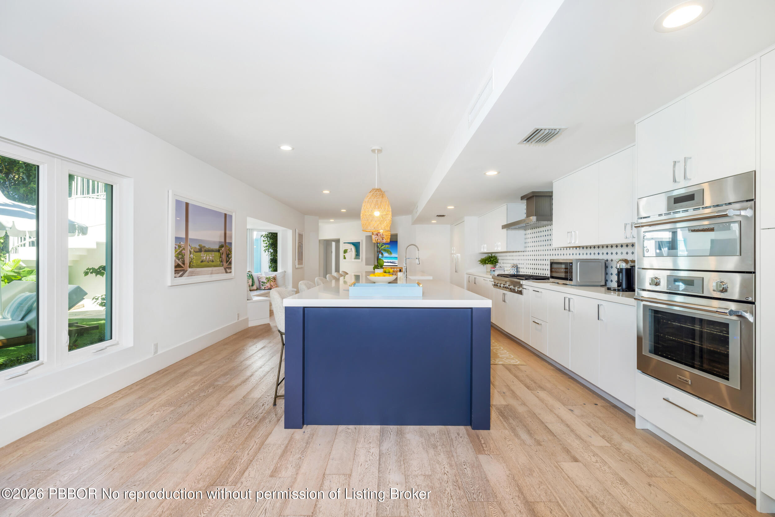 121 Seville Road West Palm Beach, FL 33405 - Photo 17 of 67 a large kitchen with stainless steel appliances granite countertop a large counter top and a wooden floors