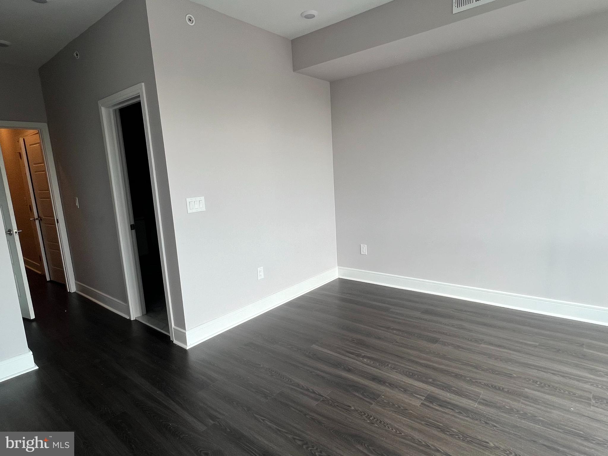 5239 Chancellor Street, Unit B Philadelphia, PA 19139 - Photo 13 of 18 an empty room with wooden floor and entrance