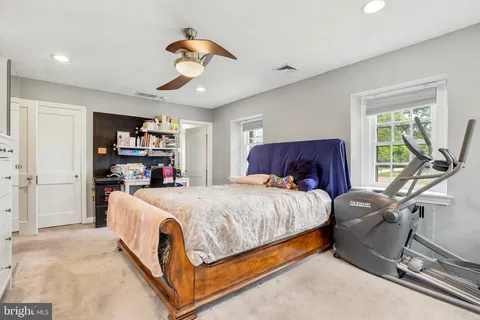 a bed room with a bed and furniture