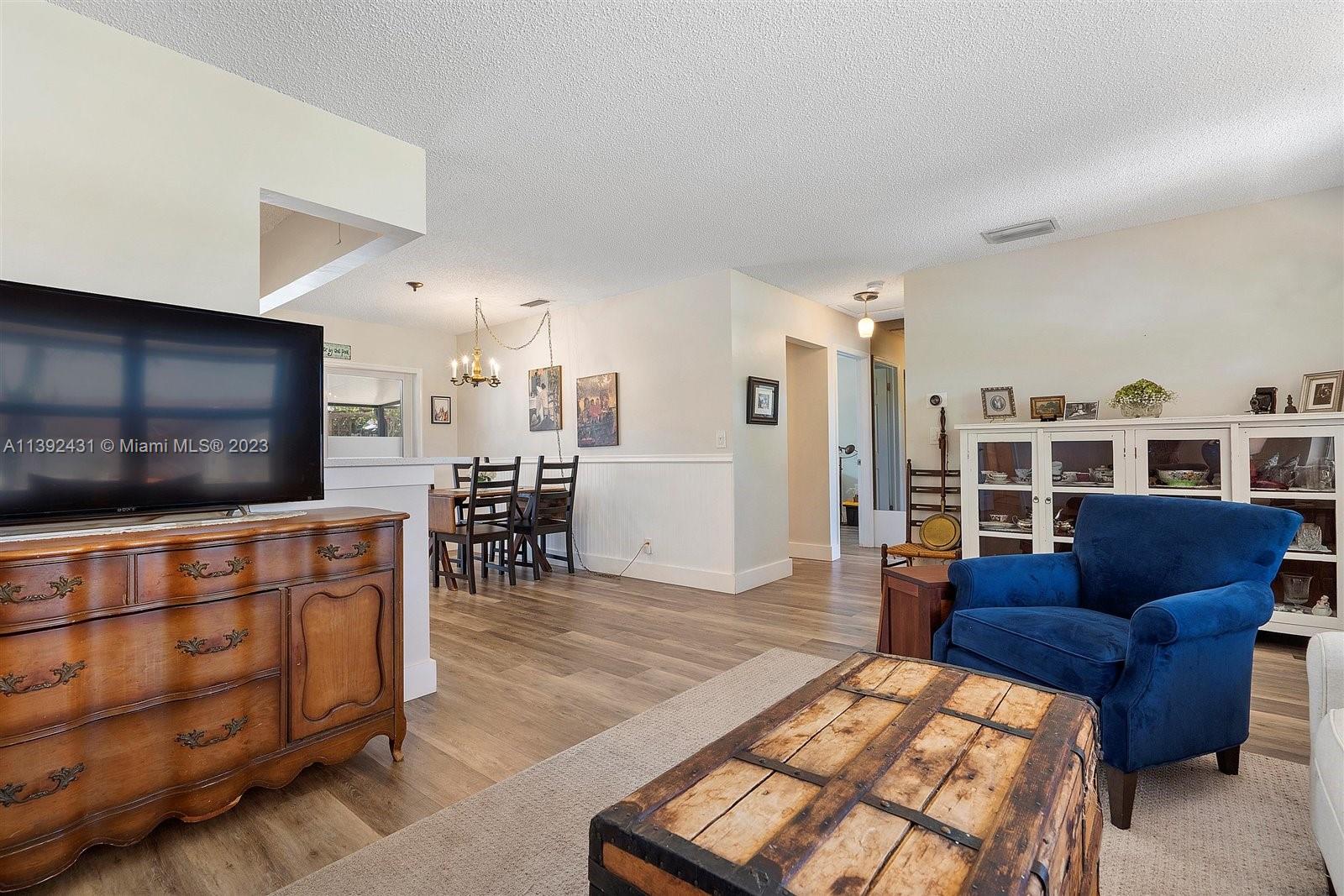 19404 Colorado Circle Boca Raton, FL 33434 - Photo 12 of 62 a living room with furniture and a flat screen tv