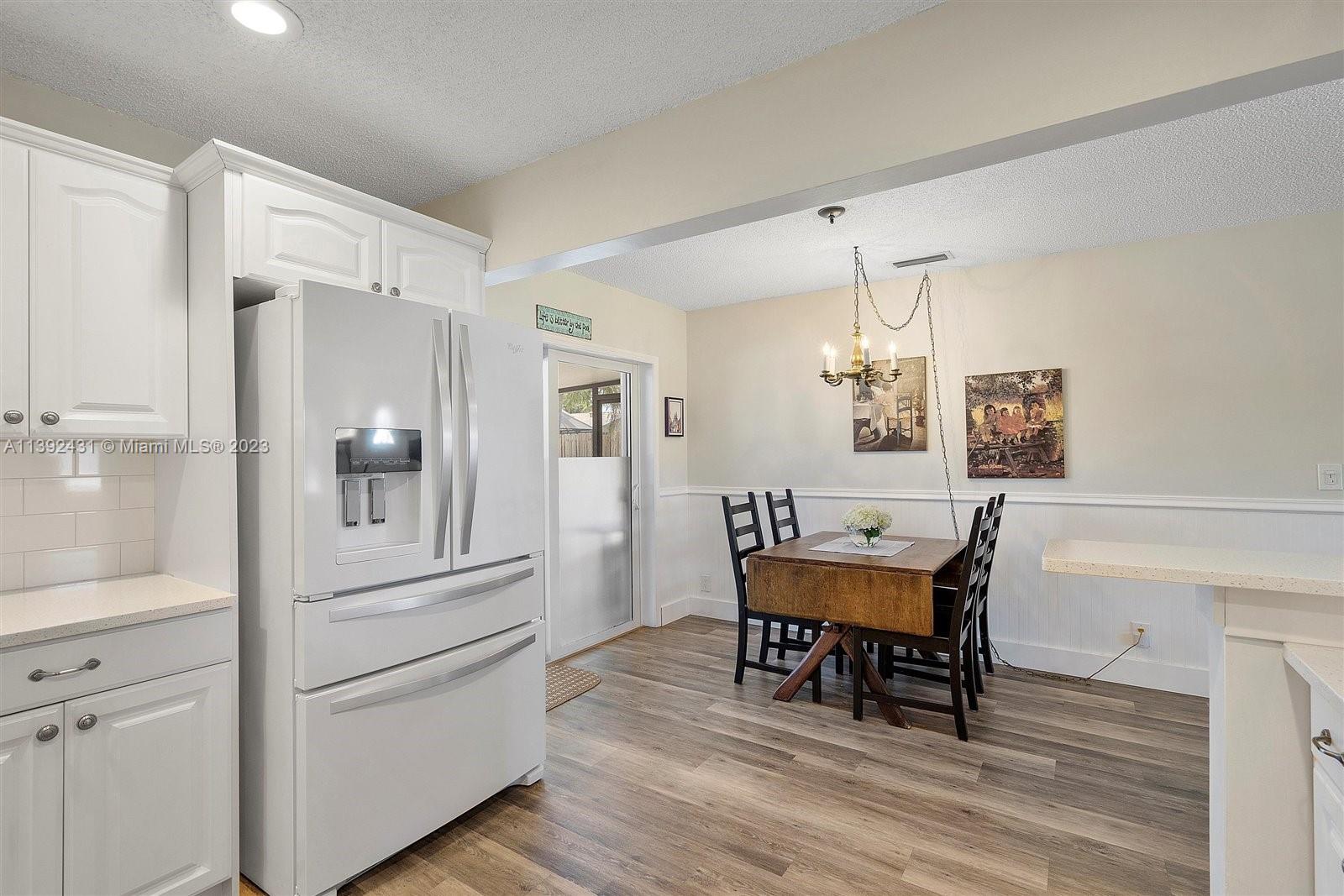 19404 Colorado Circle Boca Raton, FL 33434 - Photo 19 of 62 a dining room with furniture and wooden floor