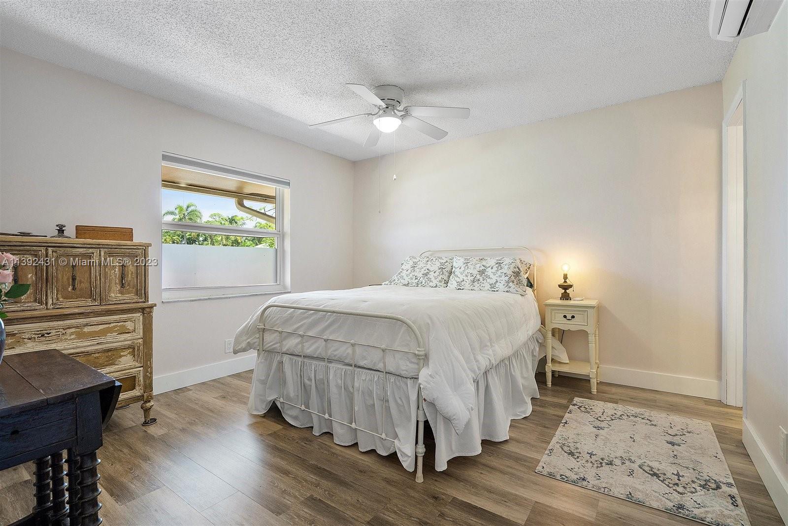 19404 Colorado Circle Boca Raton, FL 33434 - Photo 21 of 62 a bedroom with a bed and a window