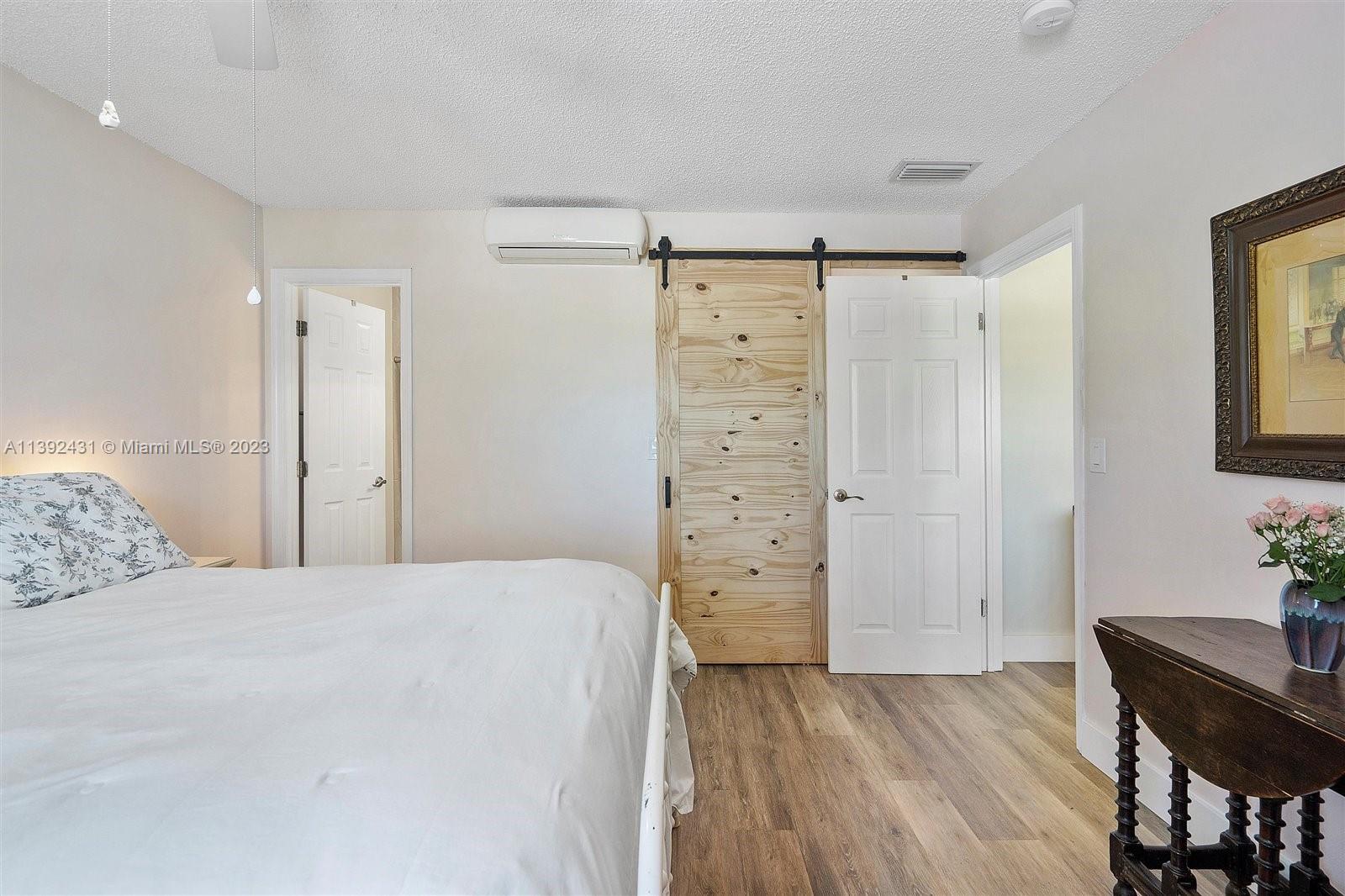 19404 Colorado Circle Boca Raton, FL 33434 - Photo 22 of 62 a bedroom with a bed and a table in it