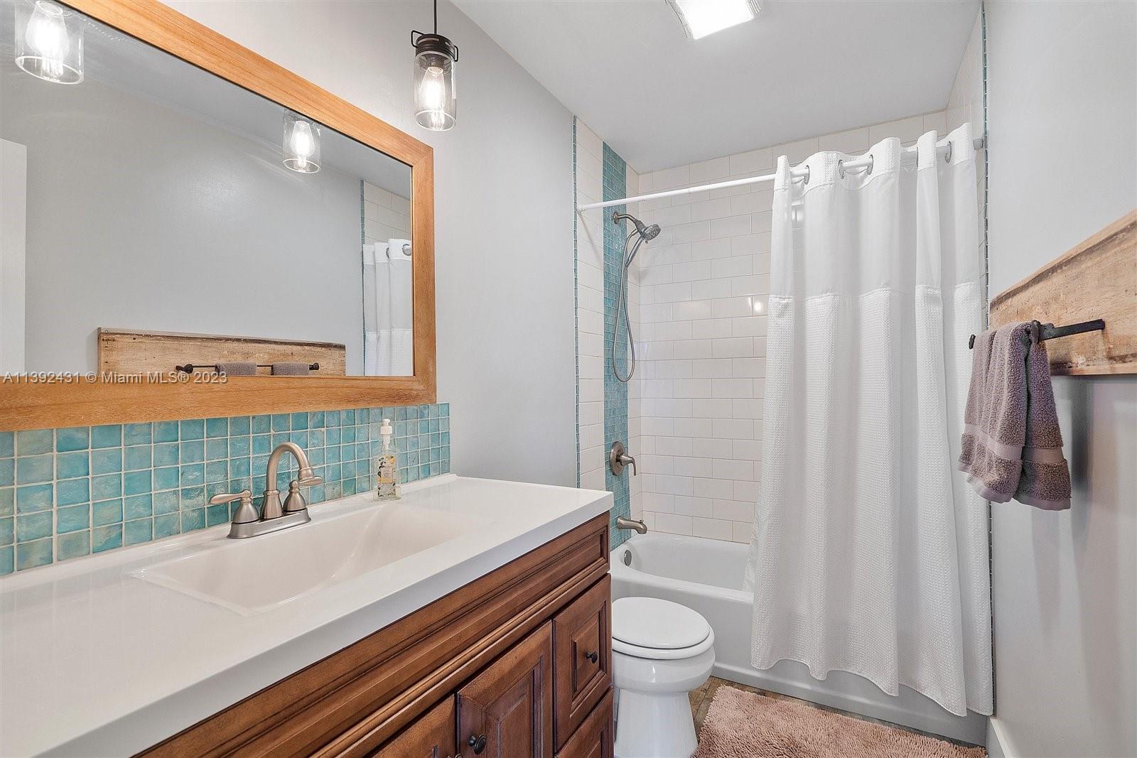 19404 Colorado Circle Boca Raton, FL 33434 - Photo 26 of 62 a bathroom with a sink a toilet and shower