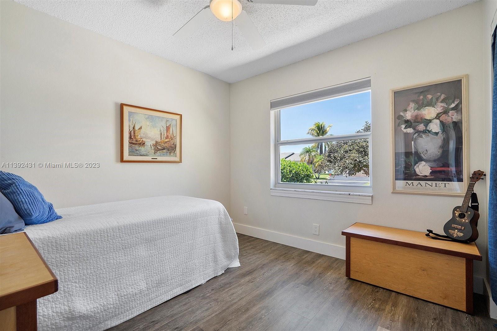 19404 Colorado Circle Boca Raton, FL 33434 - Photo 27 of 62 a bedroom with a bed and a window