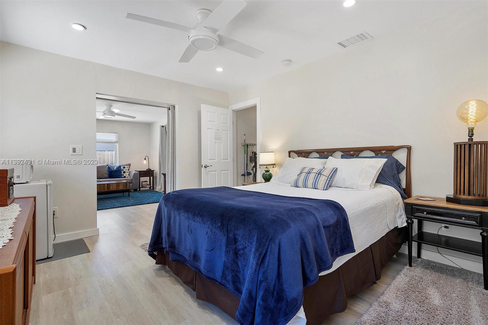 19404 Colorado Circle Boca Raton, FL 33434 - Photo 30 of 62 a spacious bedroom with a bed and a mirror