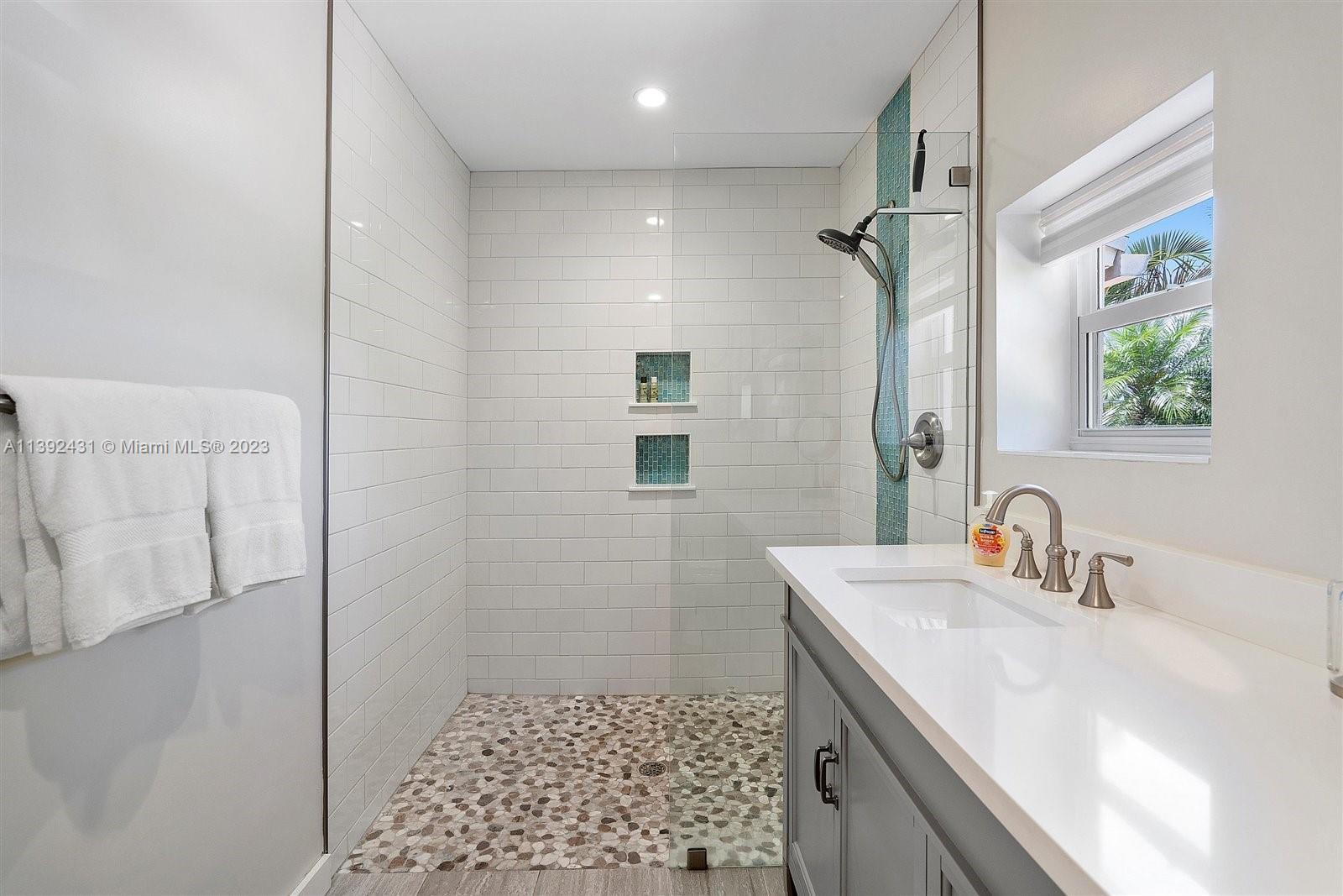 19404 Colorado Circle Boca Raton, FL 33434 - Photo 34 of 62 a bathroom with a sink a vanity and a mirror