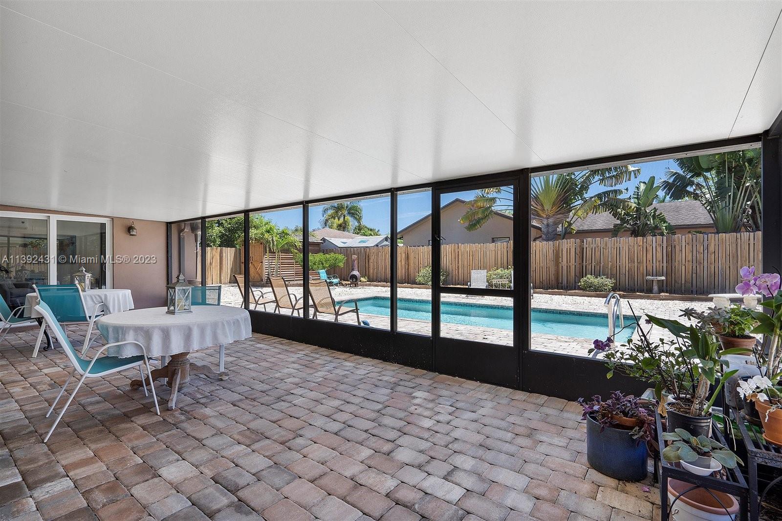19404 Colorado Circle Boca Raton, FL 33434 - Photo 36 of 62 a living room with furniture and a potted plant
