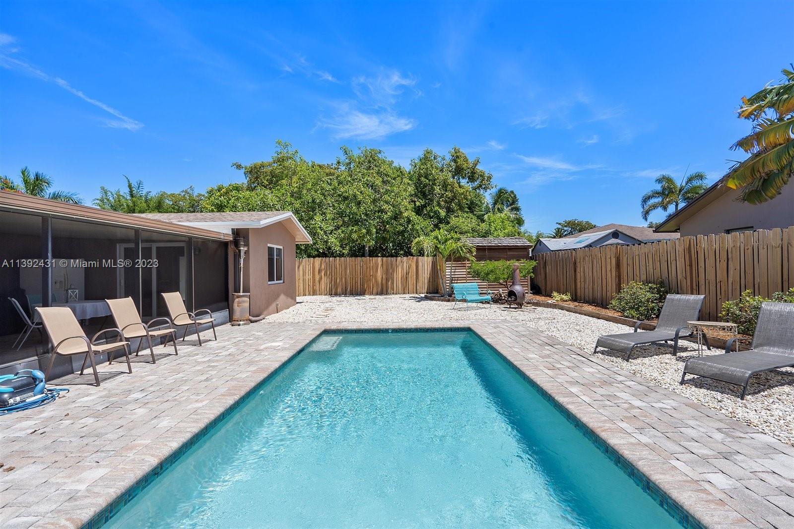 19404 Colorado Circle Boca Raton, FL 33434 - Photo 40 of 62 a view of a backyard with sitting area and furniture