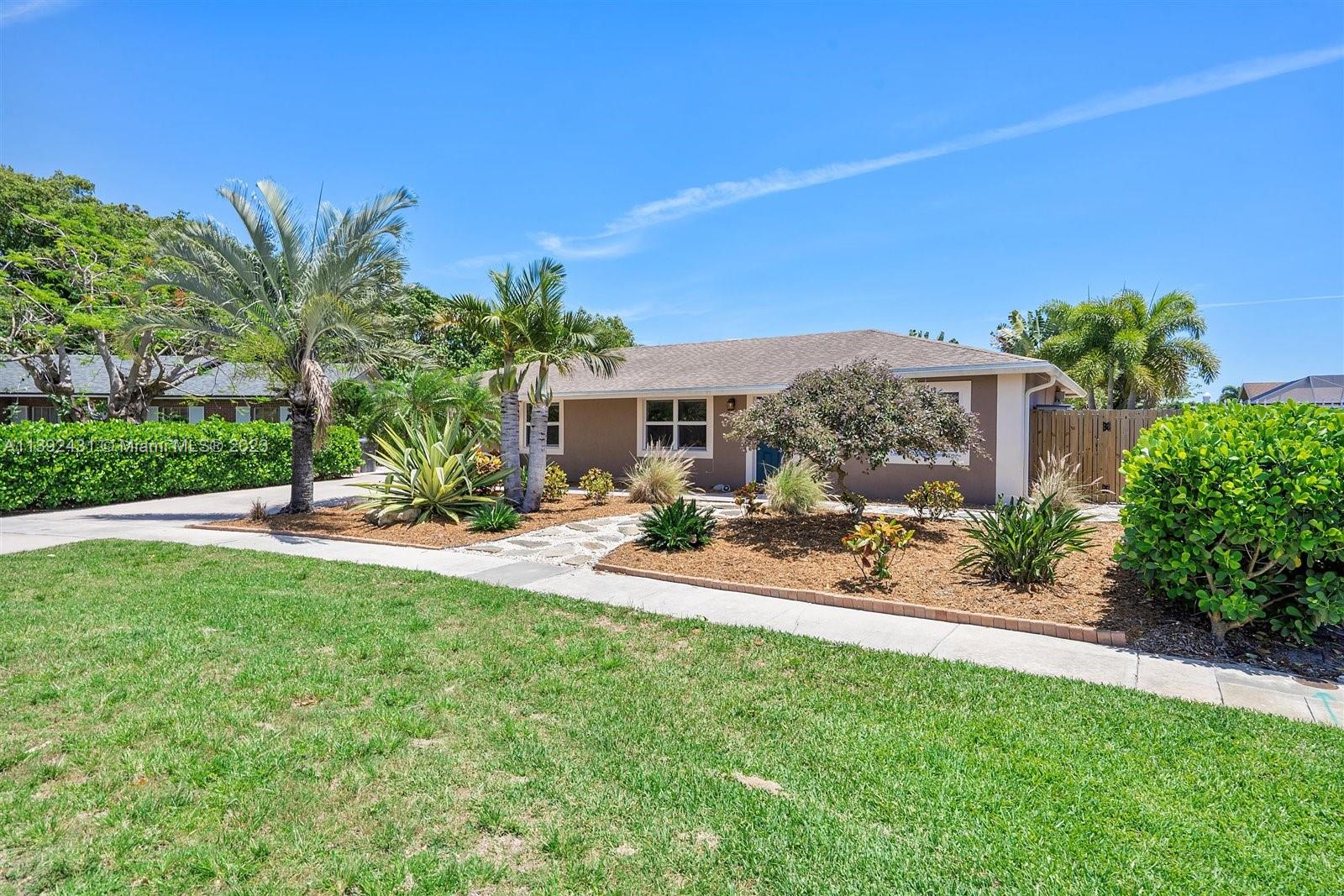 19404 Colorado Circle Boca Raton, FL 33434 - Photo 4 of 62 a view of a house with backyard sitting area and garden