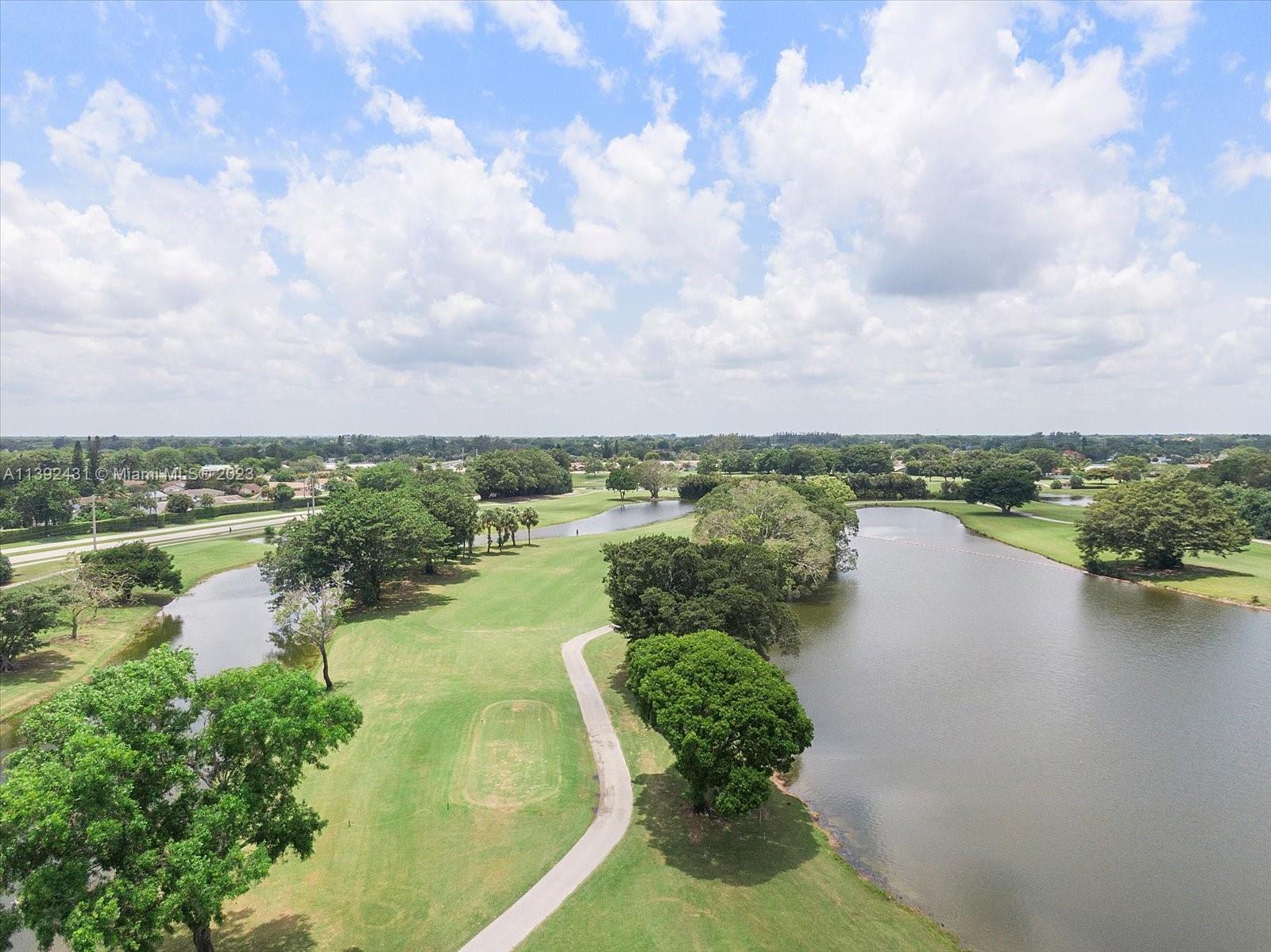 19404 Colorado Circle Boca Raton, FL 33434 - Photo 61 of 62 a view of a lake with a yard