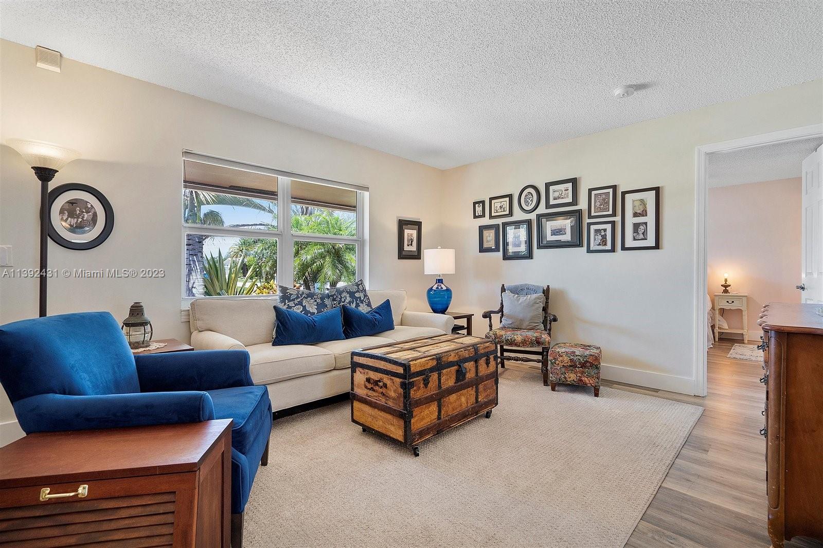 19404 Colorado Circle Boca Raton, FL 33434 - Photo 9 of 62 a living room with furniture and a large window