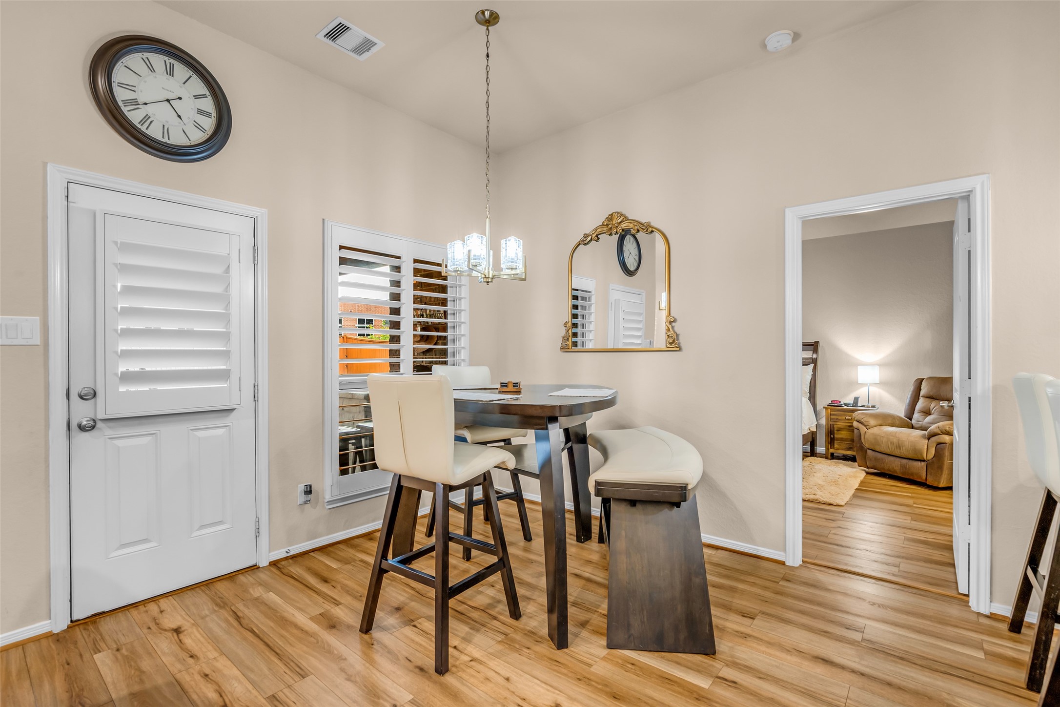 22907 Banff Brook Way Tomball, TX 77375 - Photo 12 of 26 The dining area offers a view of the backyard and includes a door that provides direct access to the outdoor space, making it convenient for indoor and outdoor living.