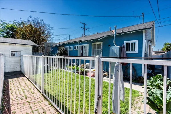 a view of a house with a small yard