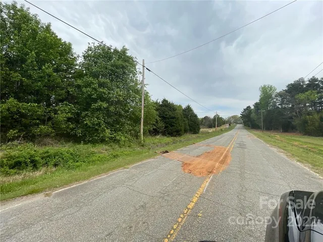 a view of lake with green space