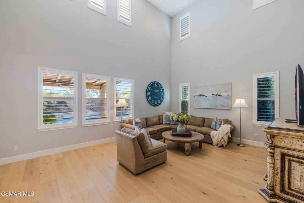 13148 Bent Grass Place Moorpark, CA 93021 - Photo 13 of 76 a living room with furniture a fireplace and a window