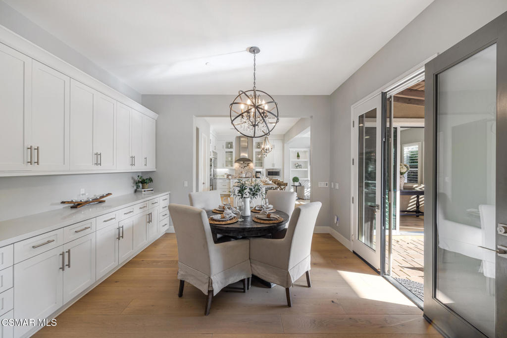 13148 Bent Grass Place Moorpark, CA 93021 - Photo 17 of 76 a view of a dining room with furniture window and wooden floor