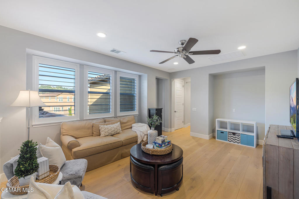 13148 Bent Grass Place Moorpark, CA 93021 - Photo 26 of 76 a living room with furniture and a large window