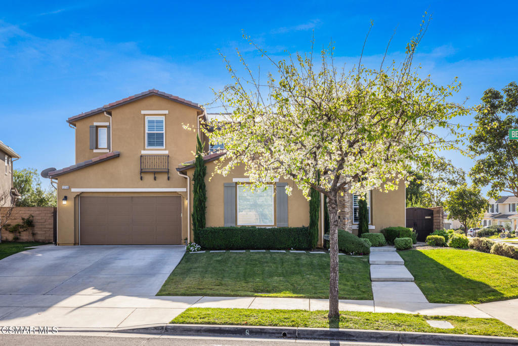 13148 Bent Grass Place Moorpark, CA 93021 - Photo 3 of 76 a front view of a house with a yard