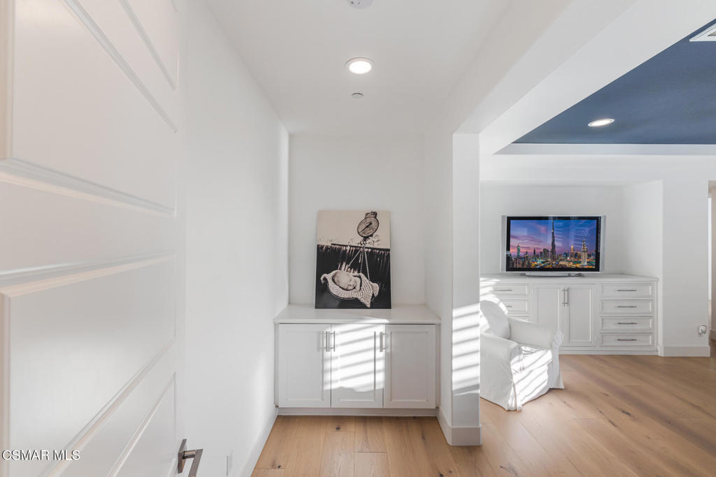 13148 Bent Grass Place Moorpark, CA 93021 - Photo 36 of 76 a living room with furniture and a wooden floor