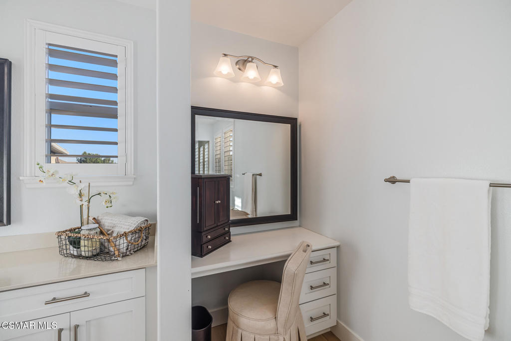 13148 Bent Grass Place Moorpark, CA 93021 - Photo 44 of 76 a bathroom with a sink and a mirror