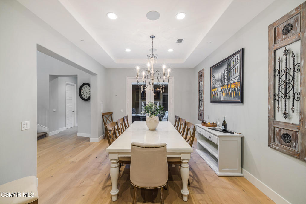 13148 Bent Grass Place Moorpark, CA 93021 - Photo 10 of 76 a view of a dining room with furniture window and wooden floor