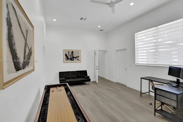 a living room with furniture and a window
