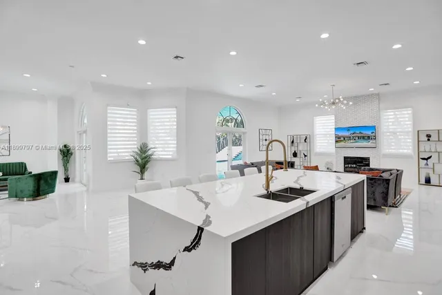 an aerial view of a house with yard swimming pool and outdoor seating
