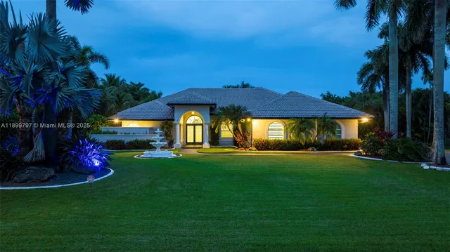 a bedroom with a bed and a night stand