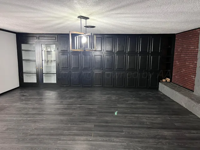 a view of a livingroom with wooden floor
