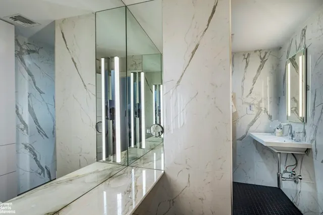 a bathroom with a bathtub and a window