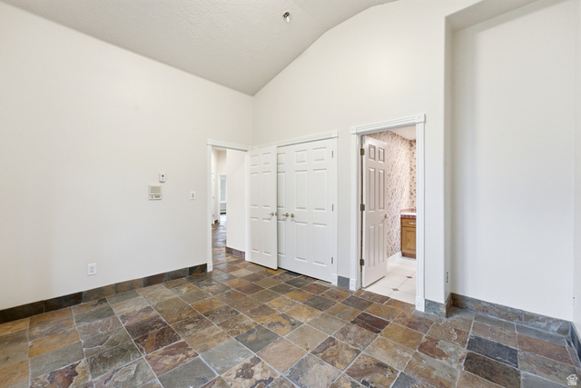 3535 Homestead Road Park City, UT 84098 - Photo 64 of 81 Vaulted ceiling room featuring natural stone tile flooring and a coordinating stone baseboard