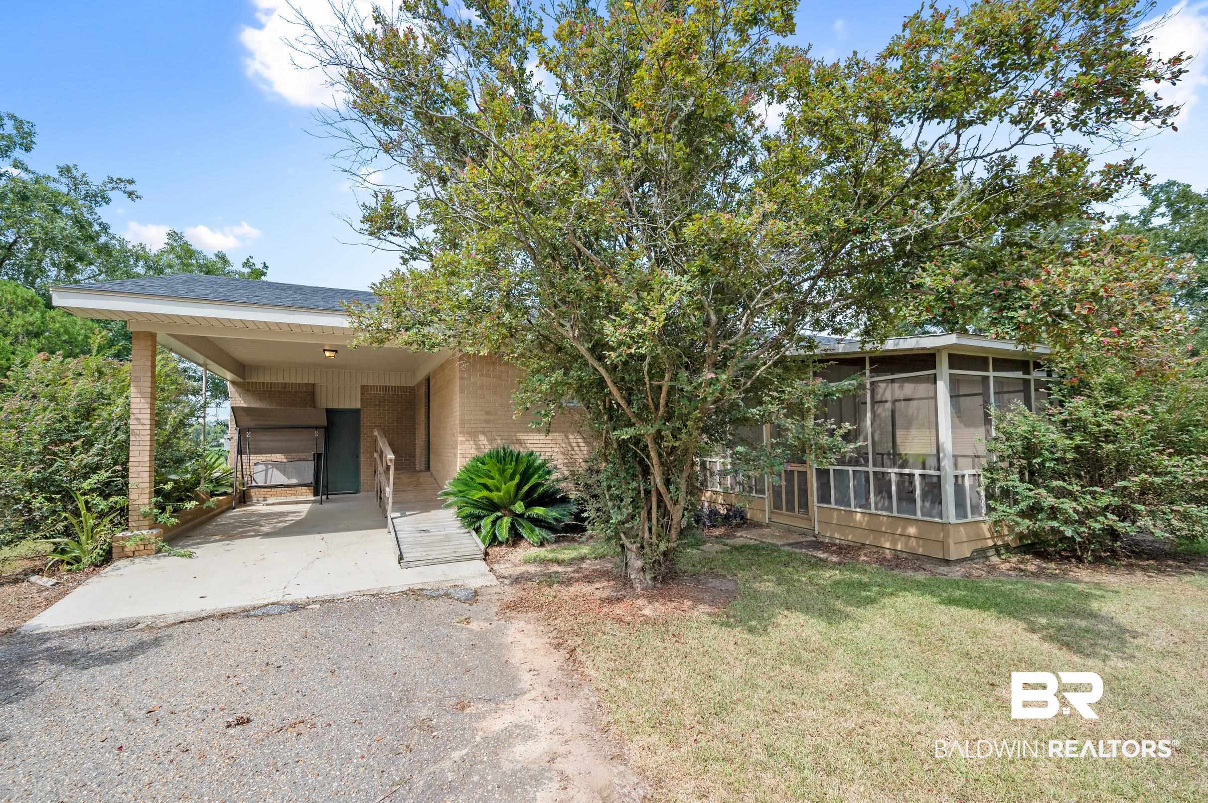 15600 Fackler Road Loxley, AL 36551 - Photo 27 of 51 View of front of property featuring a carport and a front yard