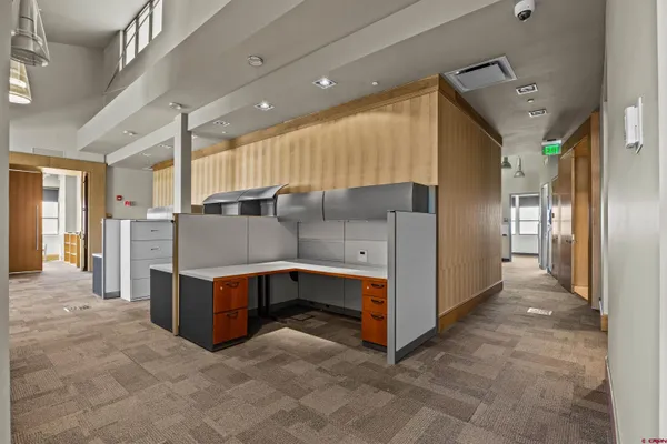 a view of kitchen and refrigerator