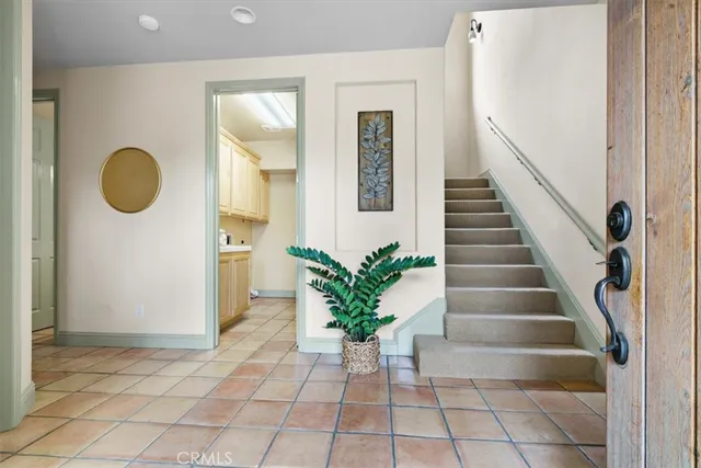 a view of entryway with wooden floor and a potted plant