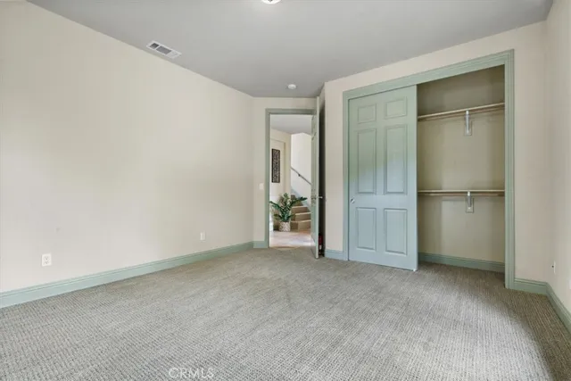 an empty room with closet area