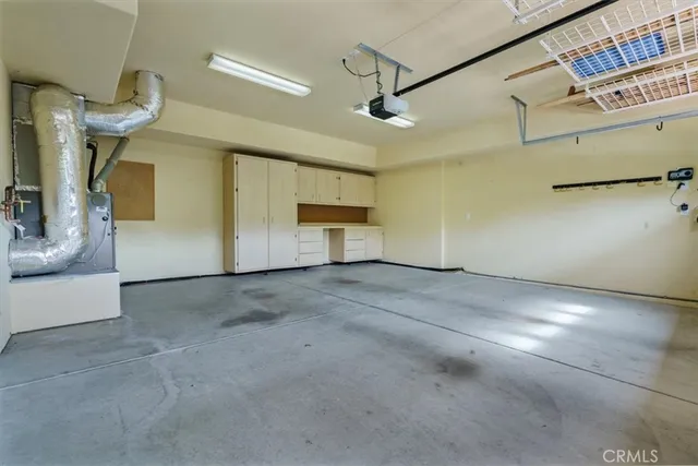 a view of a patio with table and chairs and potted plants