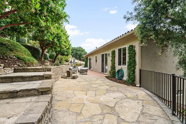 a view of backyard with sitting area