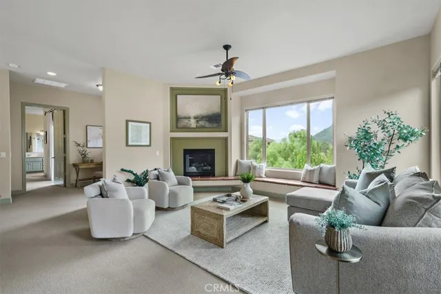 a living room with furniture and a fireplace