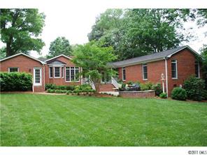1146 Andover Road Charlotte, NC 28211 - Photo 2 of 13 a front view of a house with a garden and porch