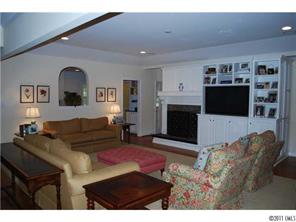 1146 Andover Road Charlotte, NC 28211 - Photo 4 of 13 a living room with furniture a flat screen tv and a fireplace