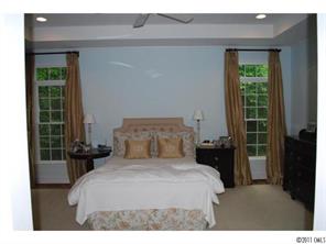 1146 Andover Road Charlotte, NC 28211 - Photo 10 of 13 a bedroom with a bed and a large window