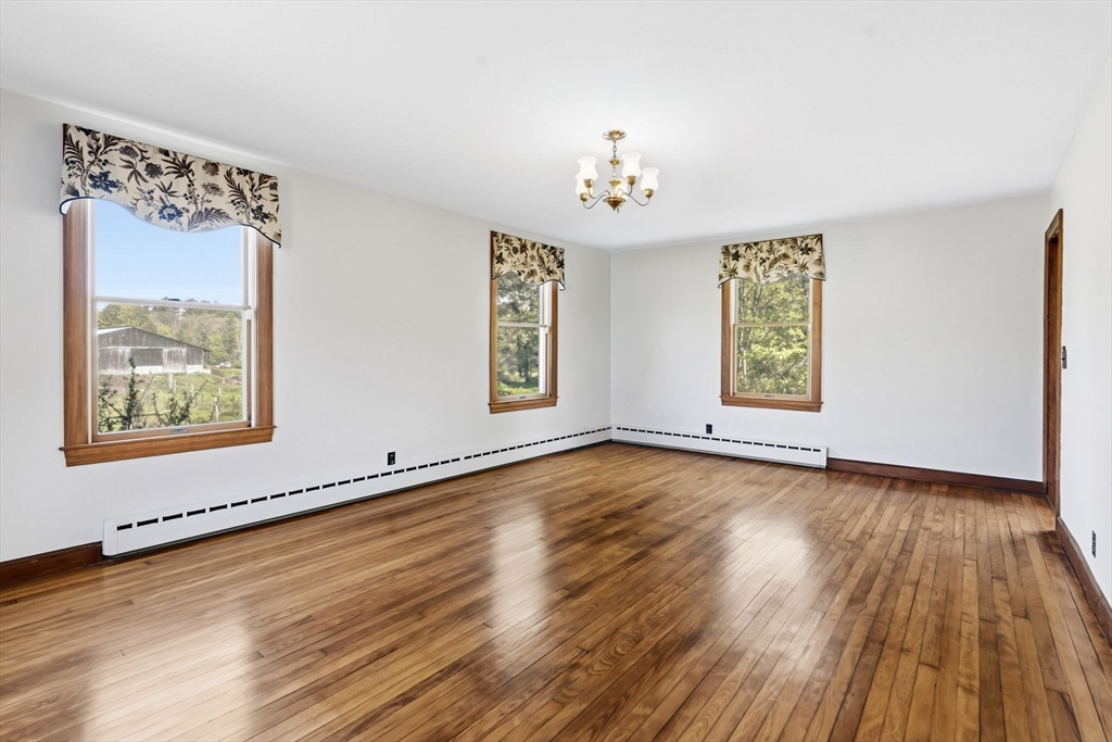 17 Moose Brook Road Southampton, MA 01073 - Photo 14 of 38 a view of an empty room with a window and wooden floor