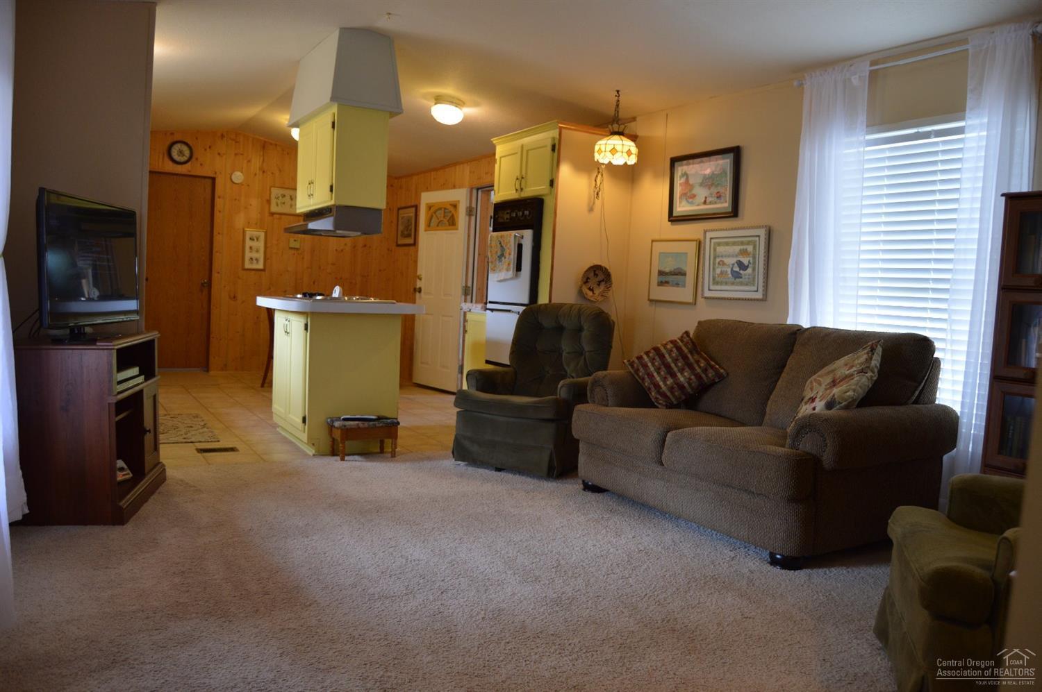 8280 Southwest Crater Loop Road Terrebonne, OR 97760 - Photo 5 of 25 Spacious living room with two large wind