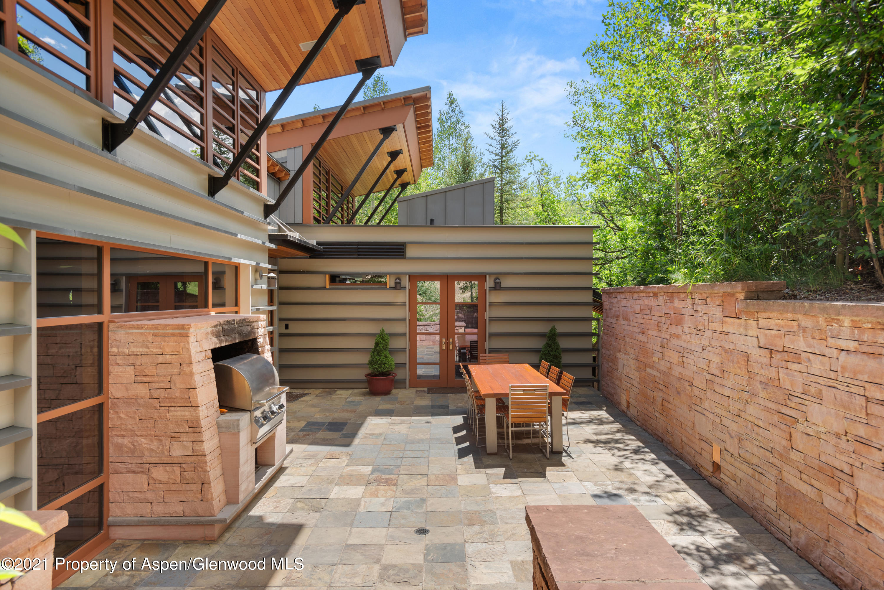 550 Aspen Alps Road South Aspen, CO 81611 - Photo 2 of 58 a backyard of a house with seating space