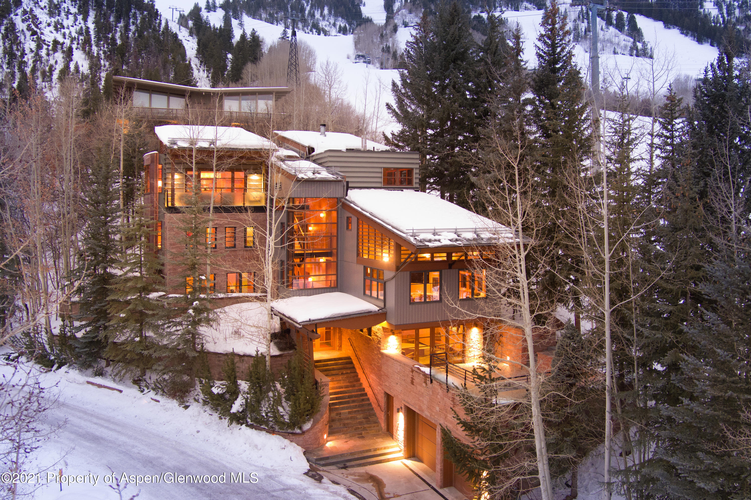 550 Aspen Alps Road South Aspen, CO 81611 - Photo 21 of 58 a view of a large building with a tree