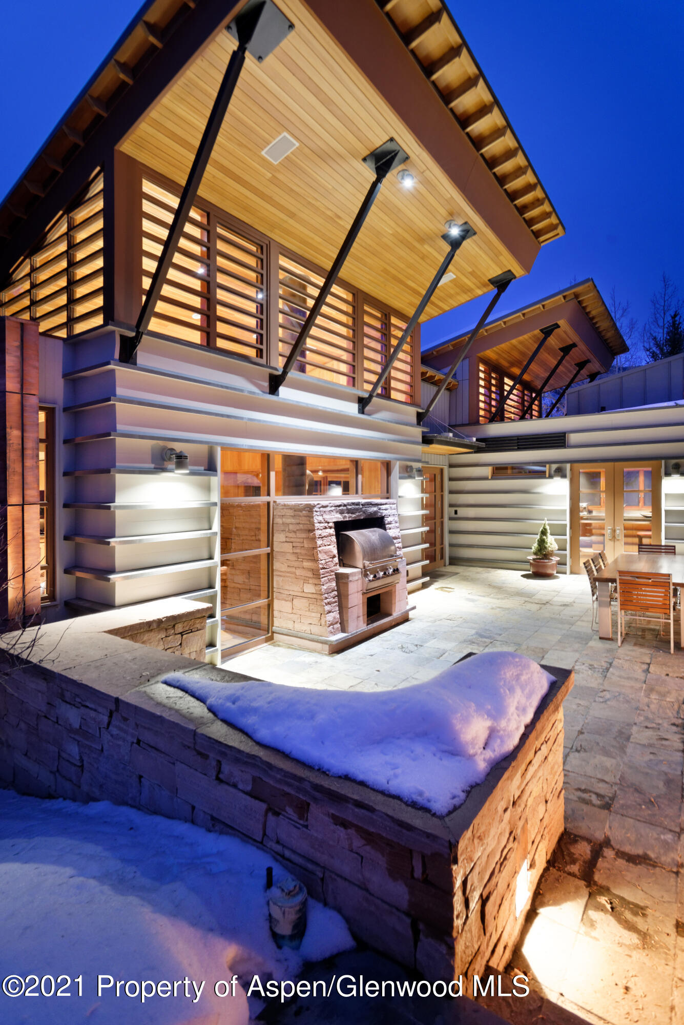 550 Aspen Alps Road South Aspen, CO 81611 - Photo 24 of 58 a view of backyard with a table and chairs